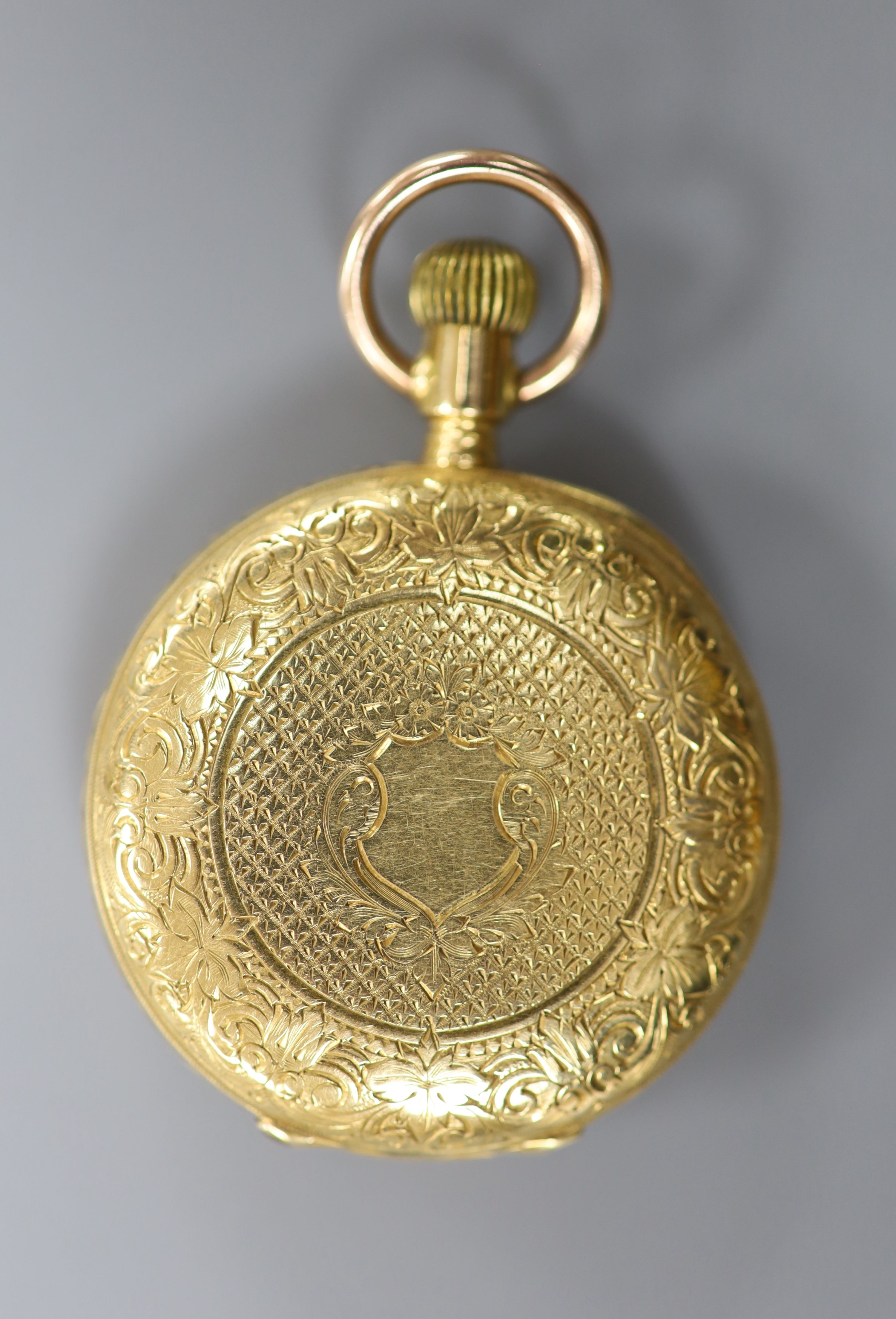 An American Waltham engraved 18ct yellow metal half hunter fob watch, case diameter 32mm, gross 44.5 grams.